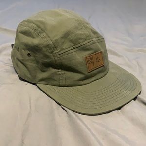 green DC 5 panel hat with buckle up strap back